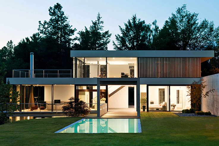 Von Bock Architekten naturverbunden Wohnen Glasfront Pool Sonnenterrasse